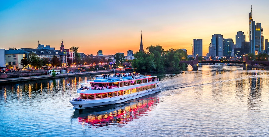 Evening cruise on the Main River with Frankfurt skyline in the background.