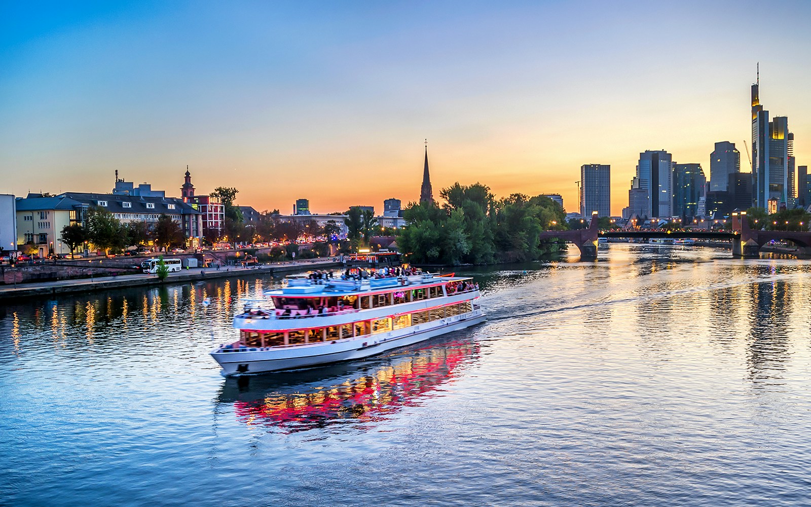 Frankfurt skyline view from evening panorama cruise on the Main River.