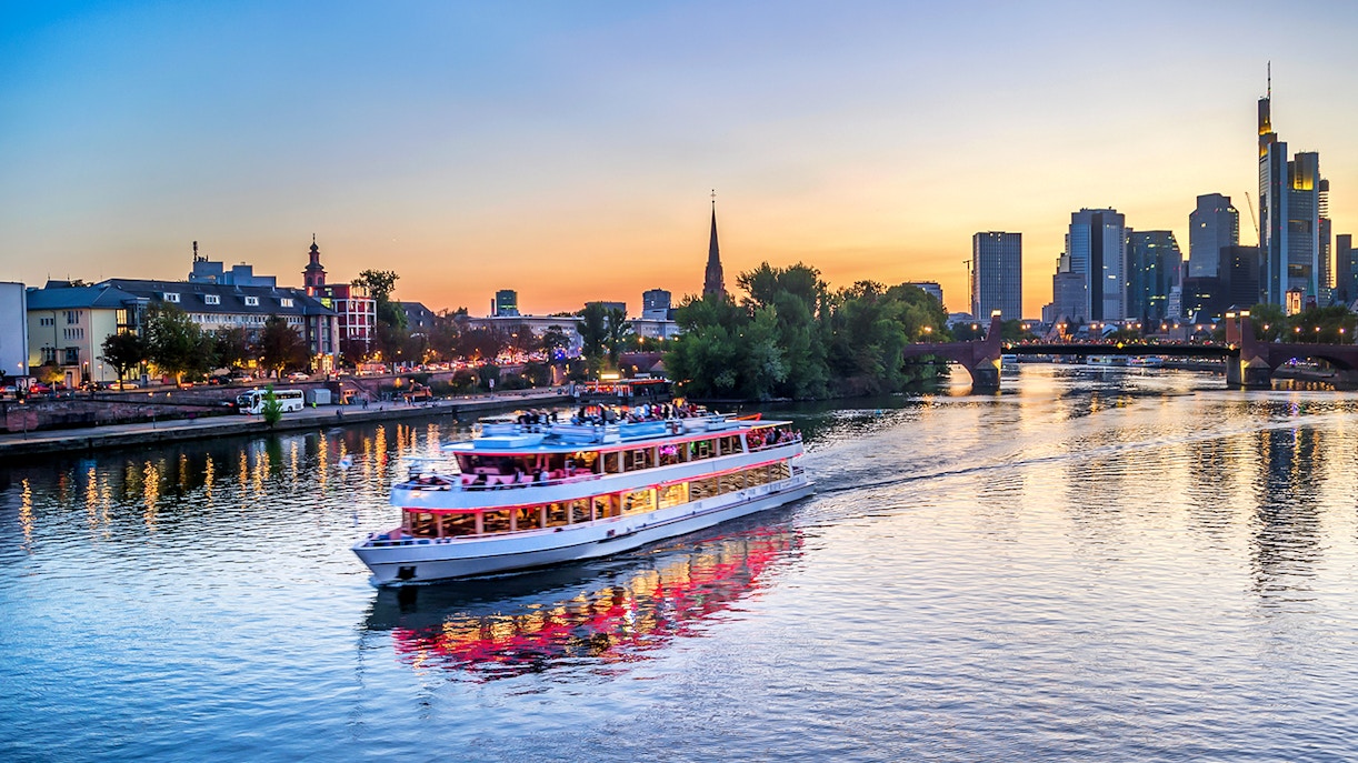 Evening cruise on the Main River with Frankfurt skyline in the background.