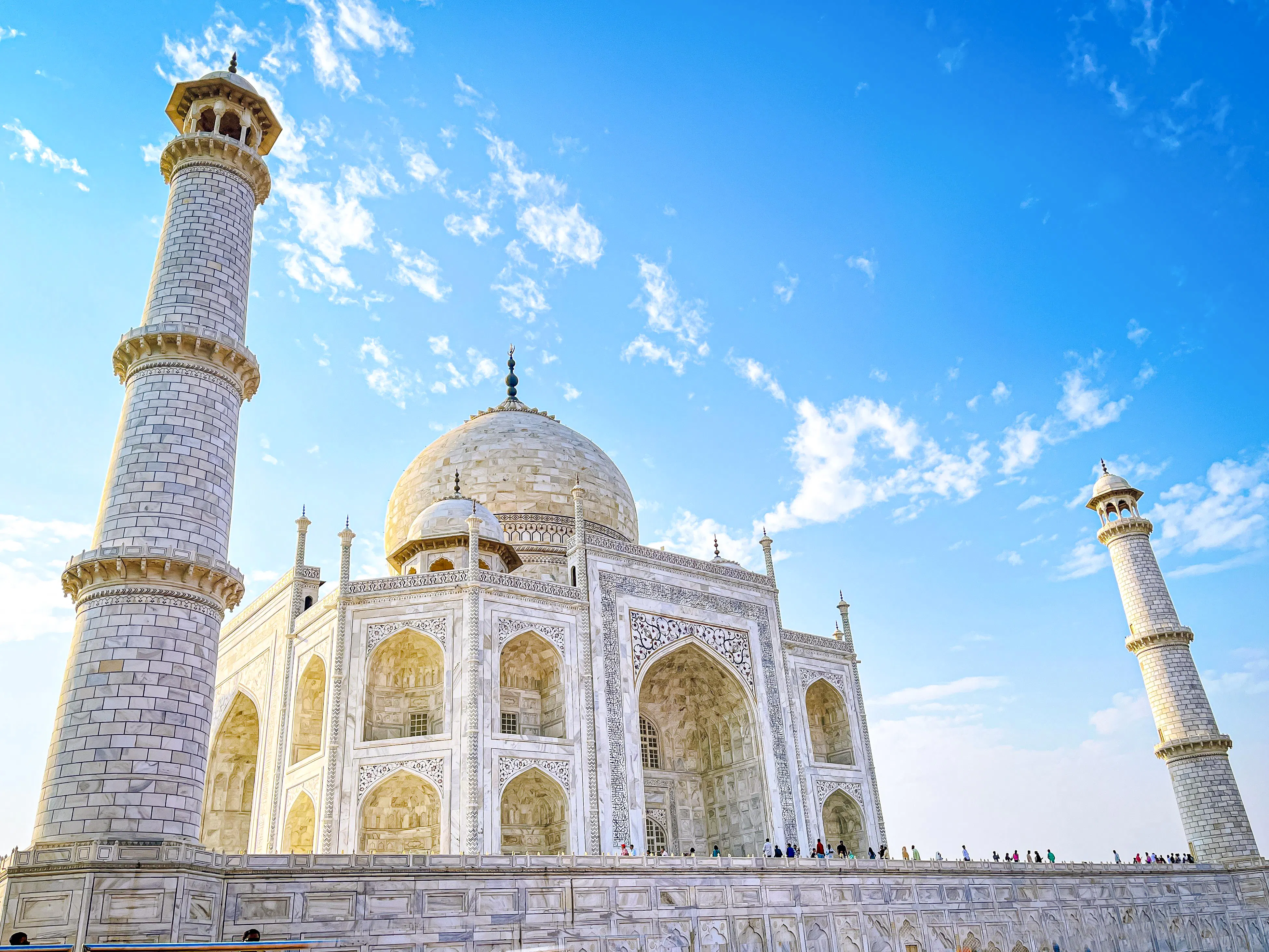 Taj Mahal with minarets under blue sky, Agra, India.