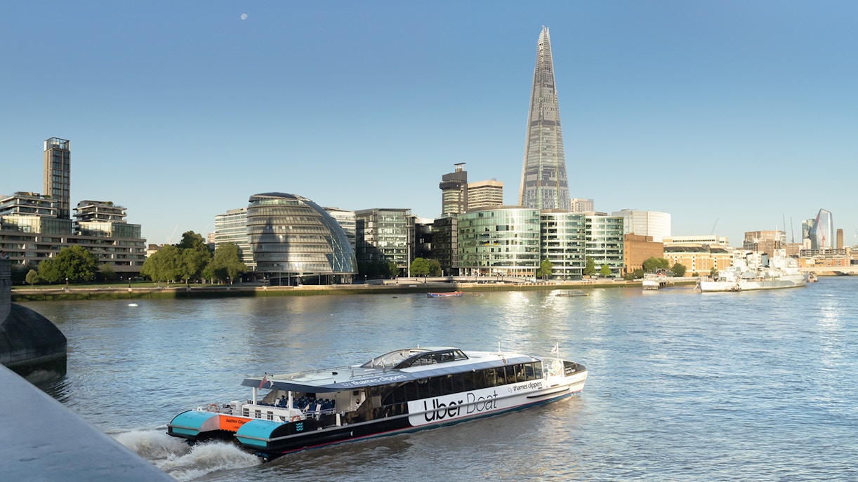 Uber Boat by Thames Clippers on the River Thames with London skyline.