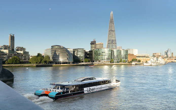 Uber Boat by Thames Clippers on the River Thames with London skyline.