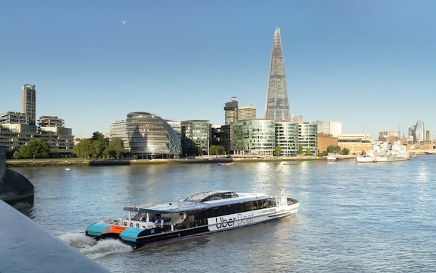 Uber Boat by Thames Clippers on the River Thames with London skyline.