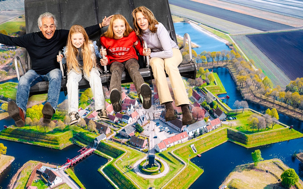 Tourists on 5D ride at This Is Holland, Amsterdam, viewing Dutch landscape.