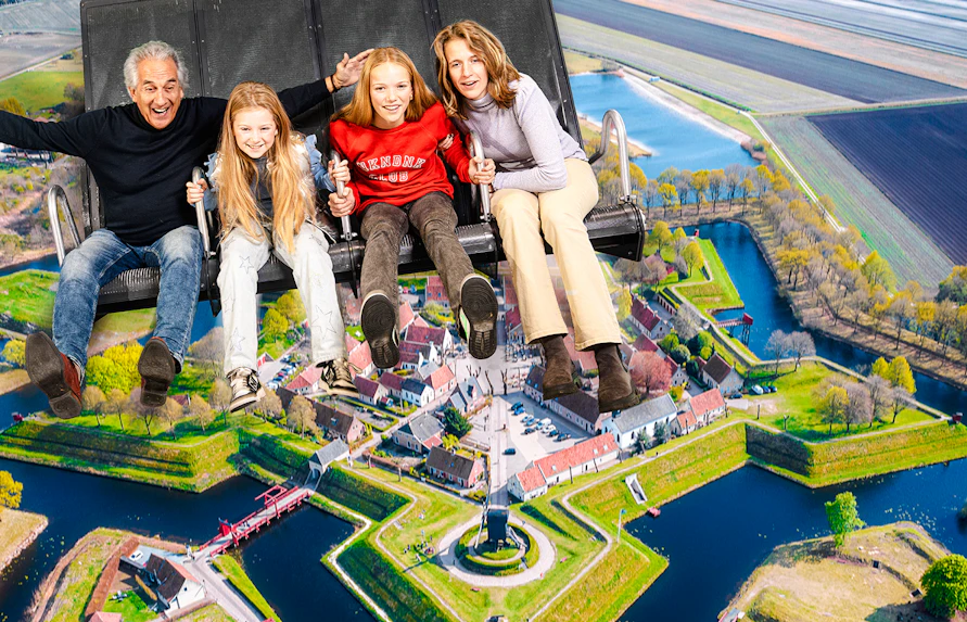 Tourists on 5D ride at This Is Holland, Amsterdam, viewing Dutch landscape.