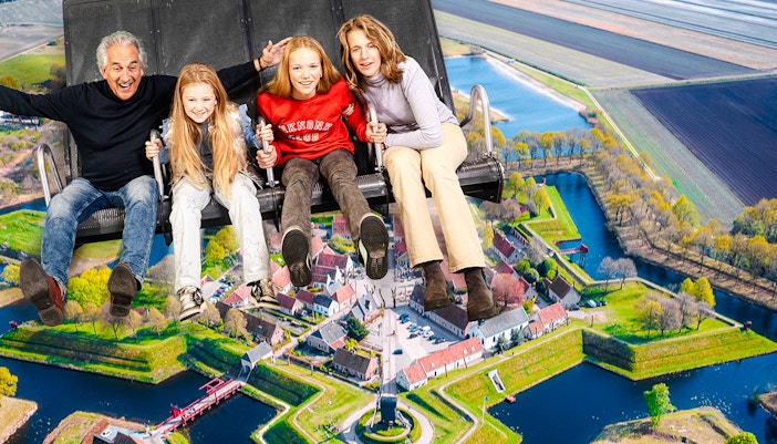 Tourists on 5D ride at This Is Holland, Amsterdam, viewing Dutch landscape.