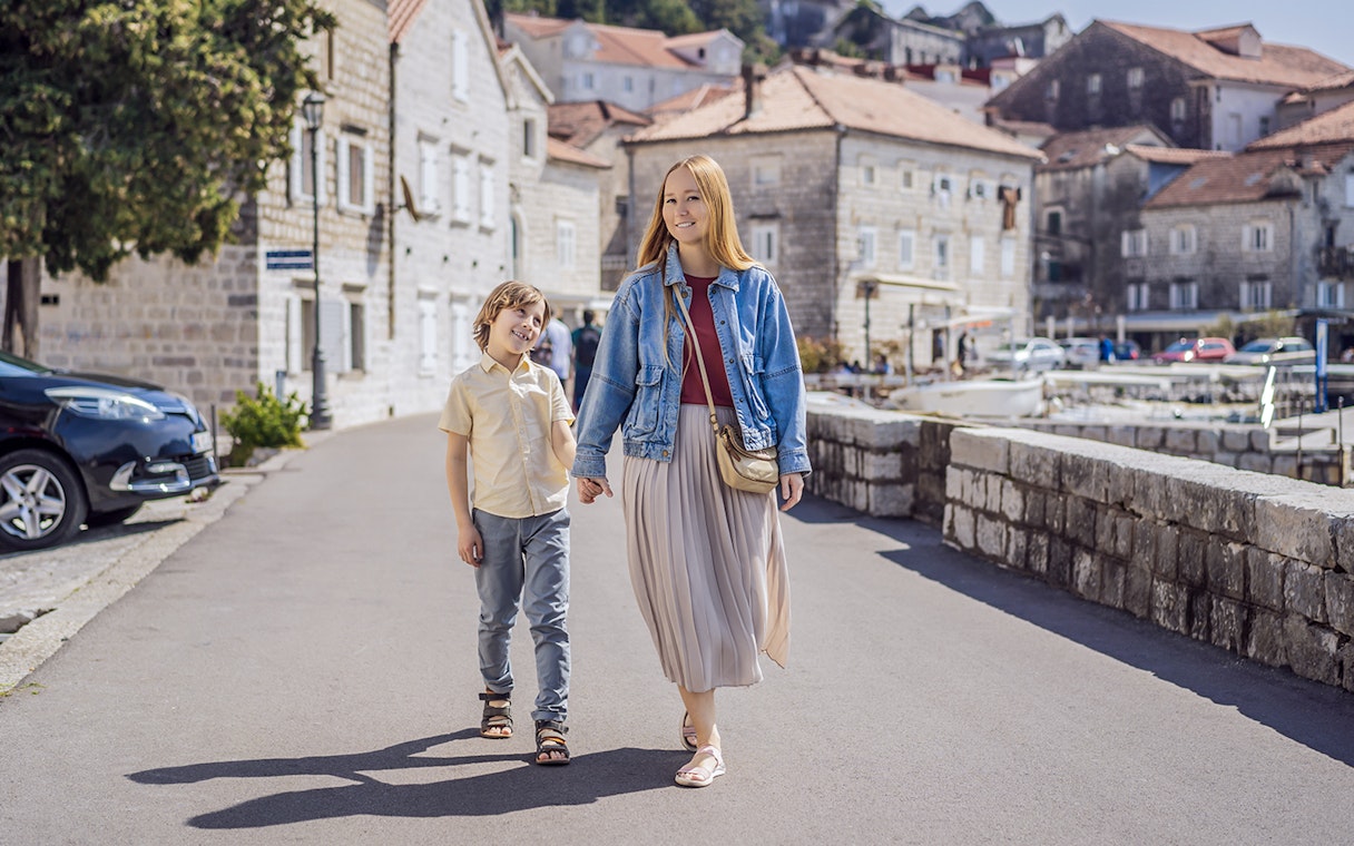 Family walking in Perast Town during Montenegro tour.