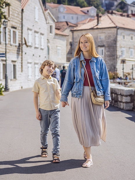 Family walking in Perast Town during Montenegro tour.