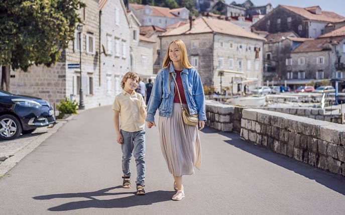 Family walking in Perast Town during Montenegro tour.