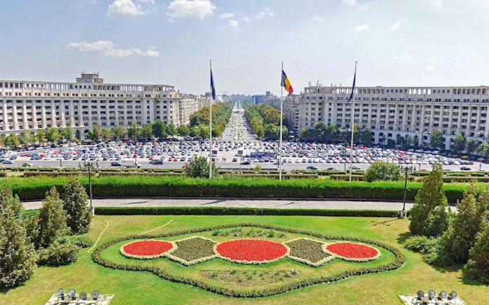 View of the Palace of Parliament gardens and boulevard in Bucharest, Romania.