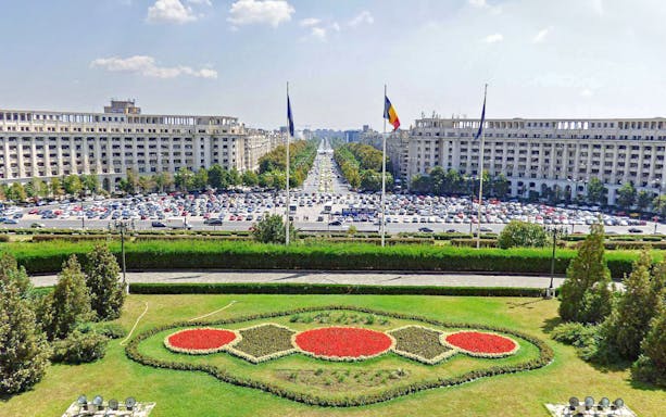 View of the Palace of Parliament gardens and boulevard in Bucharest, Romania.
