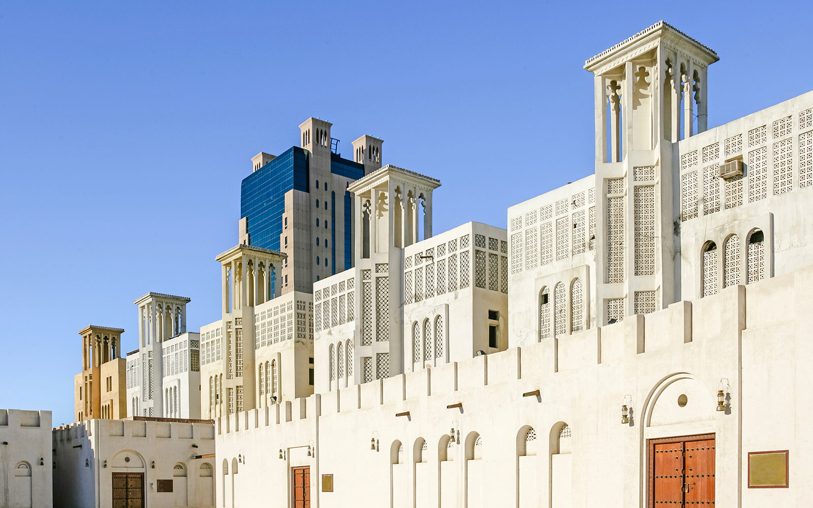 Traditional wind towers in Sharjah's Heritage Area, UAE.