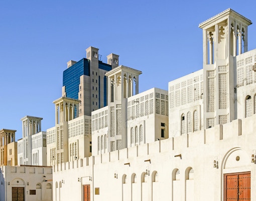 Traditional wind towers in Sharjah's Heritage Area, UAE.