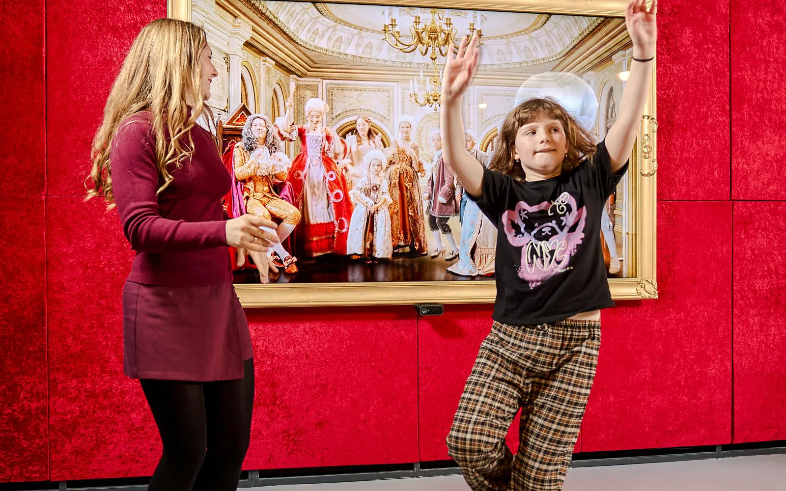 Guests interacting with exhibits at Mozart Interactive Museum in Prague.