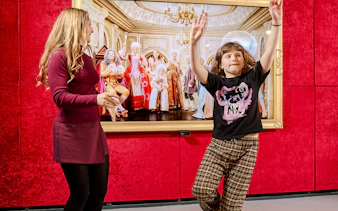 Guests interacting with exhibits at Mozart Interactive Museum in Prague.