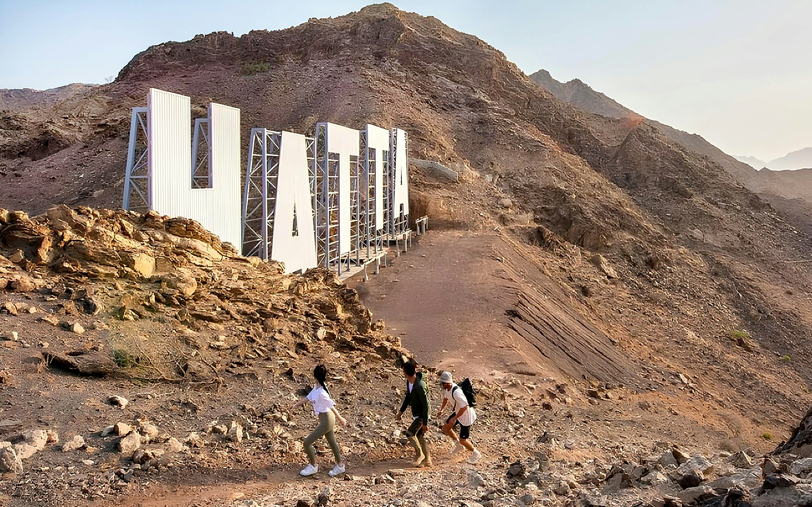 Group of hikers exploring the rugged terrain of Hatta Wadi