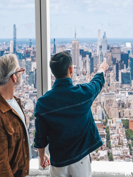 Visitors enjoying the New York City skyline from One World Observatory.