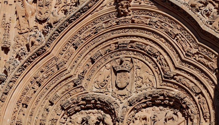 Ornate stone carvings on Salamanca Cathedral facade, Spain.