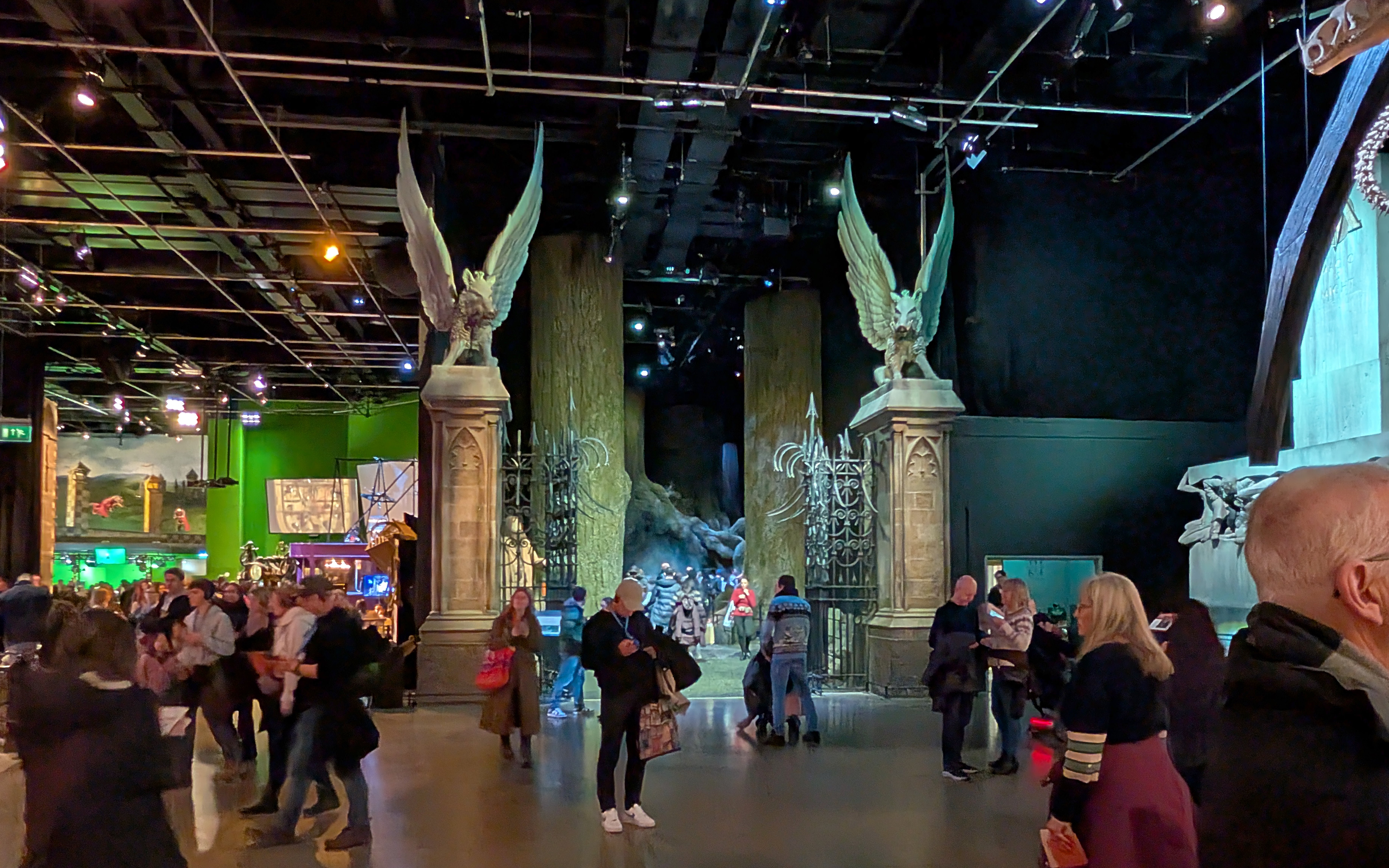 Visitors exploring the Hogwarts Great Hall set at Warner Bros. Studio Tour London.