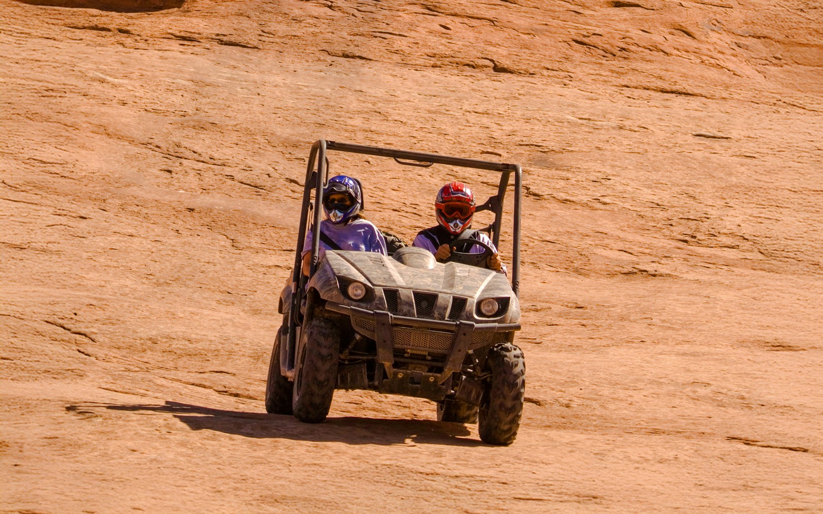 Tourists riding an ATV
