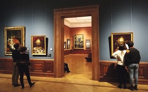 Visitors viewing paintings at the Museum of Fine Arts in Budapest.