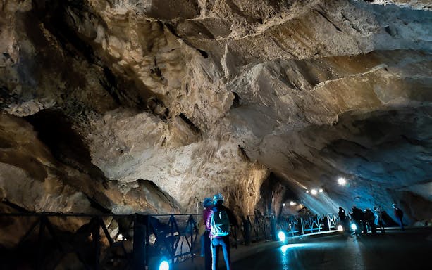 Visitors exploring San Giovanni Caves on Vagoni Path tour.