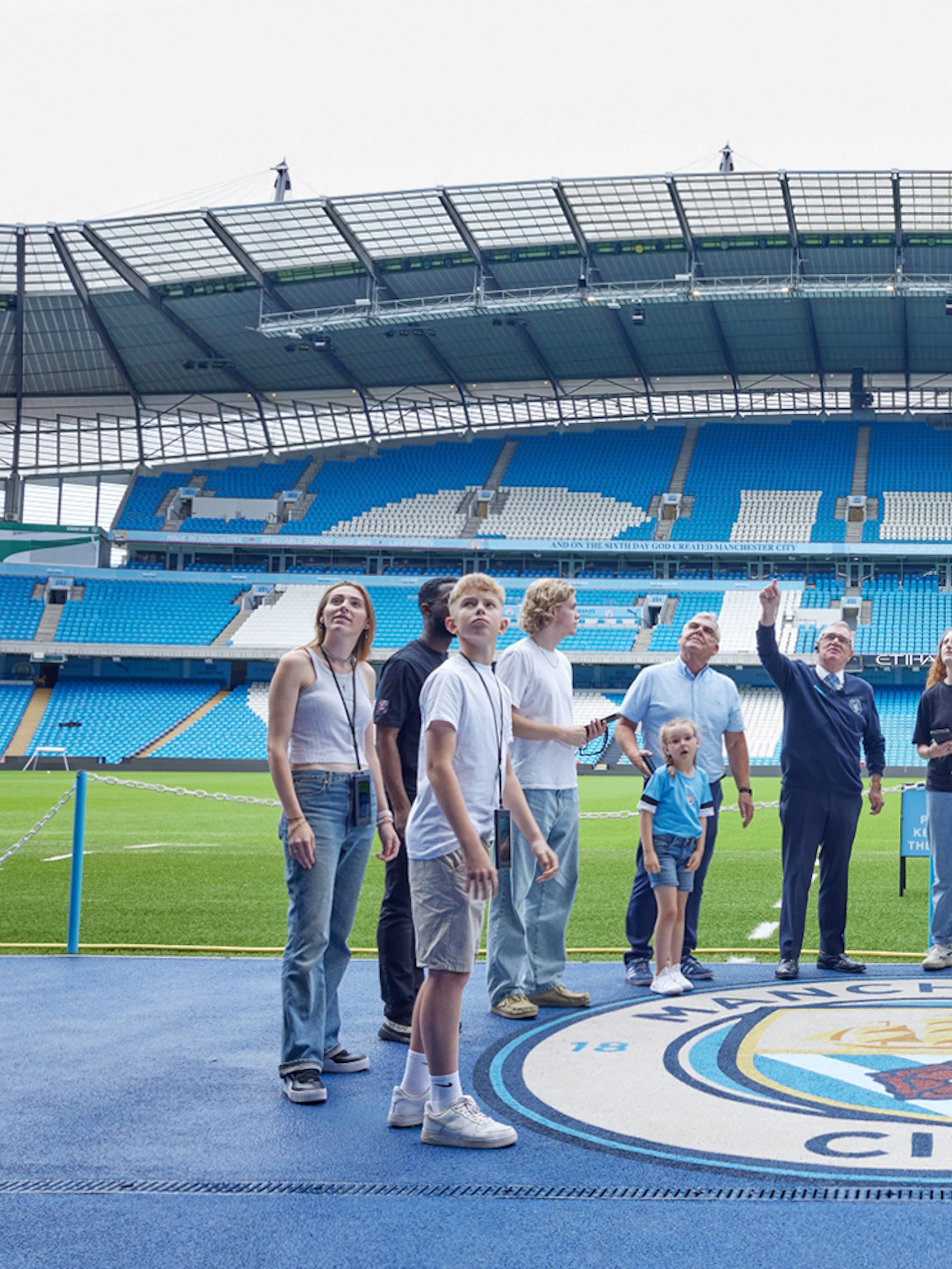 Visitors on a guided tour at Etihad Stadium, home of Manchester City FC.