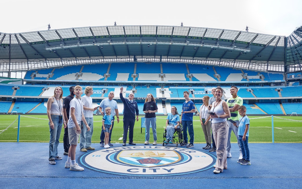 Visitors on a guided tour at Etihad Stadium, home of Manchester City FC.
