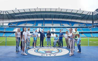 Visitors on a guided tour at Etihad Stadium, home of Manchester City FC.