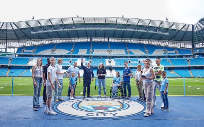 Visitors on a guided tour at Etihad Stadium, home of Manchester City FC.
