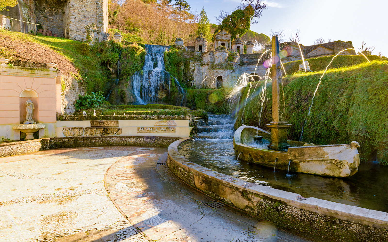 Villa D'Este fountains and gardens in Tivoli, Italy, featuring cascading waterfalls and ornate sculptures.