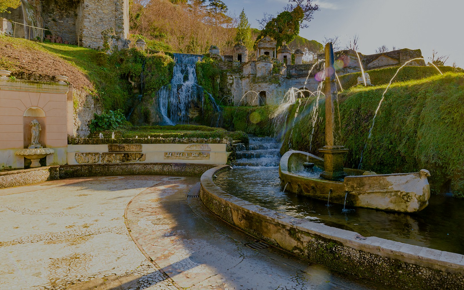 Villa D'Este fountains and gardens in Tivoli, Italy, featuring cascading waterfalls and ornate sculptures.