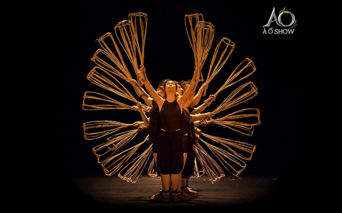 Women performing with bamboo props at AO Show.