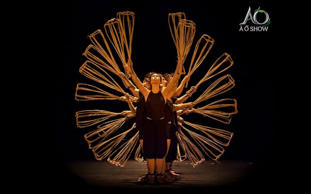 Women performing with bamboo props at AO Show.