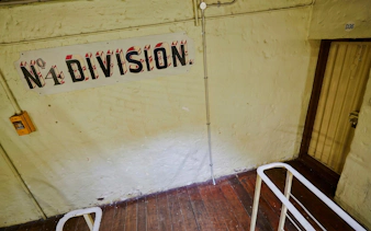 Fremantle Prison interior showing Division 4 sign and cell door.