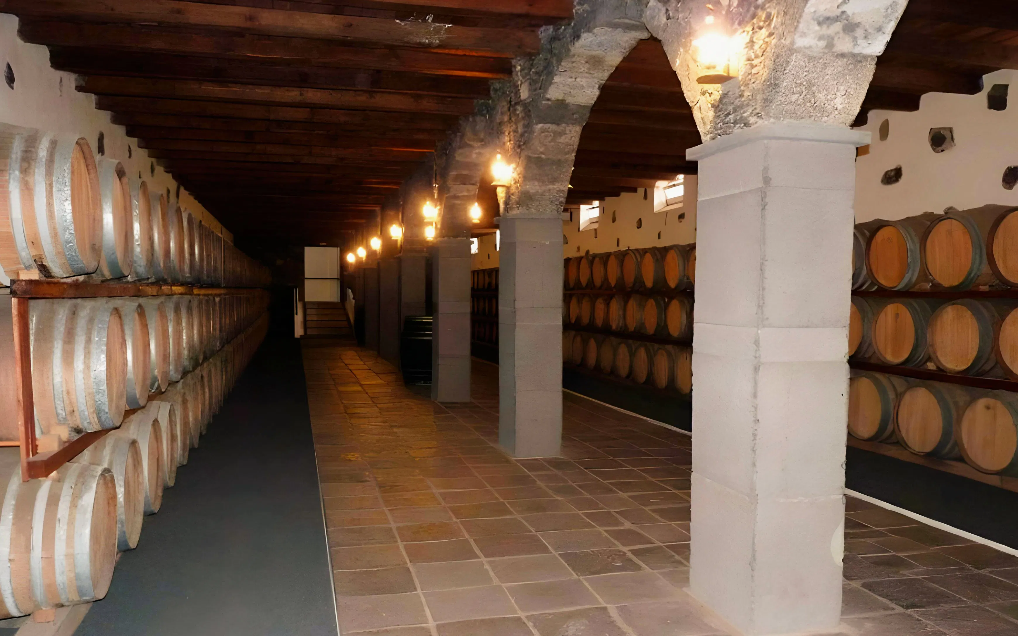 La Geria wine cellar with rows of wooden barrels in Lanzarote, Spain.