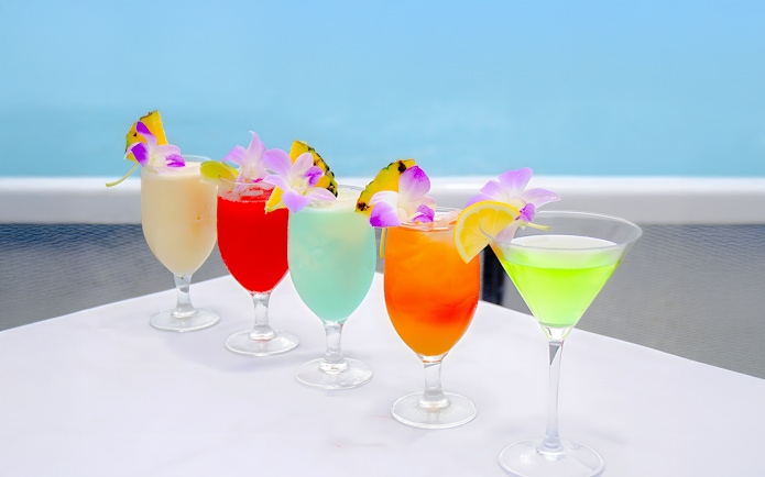 Colorful cocktails with tropical garnishes on the Star of Honolulu, Three Star cruise.