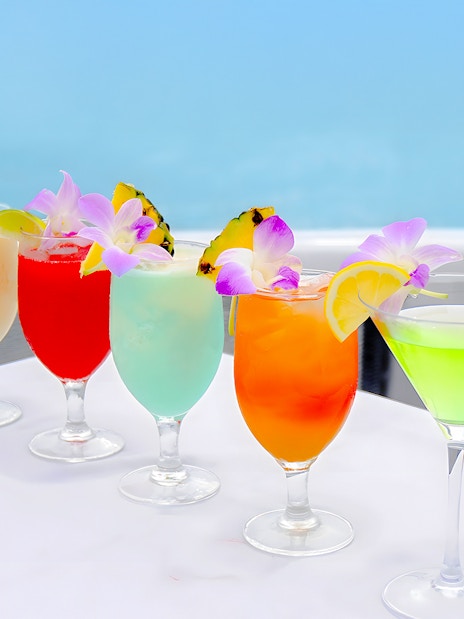 Colorful cocktails with tropical garnishes on the Star of Honolulu, Three Star cruise.