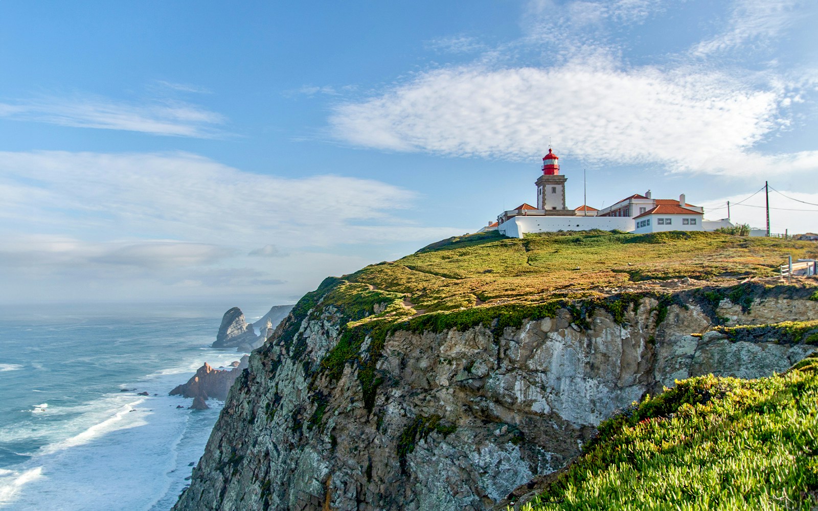 Cabo Da Roca lighthouse on a cliff in Sintra Mountain Range, Portugal.