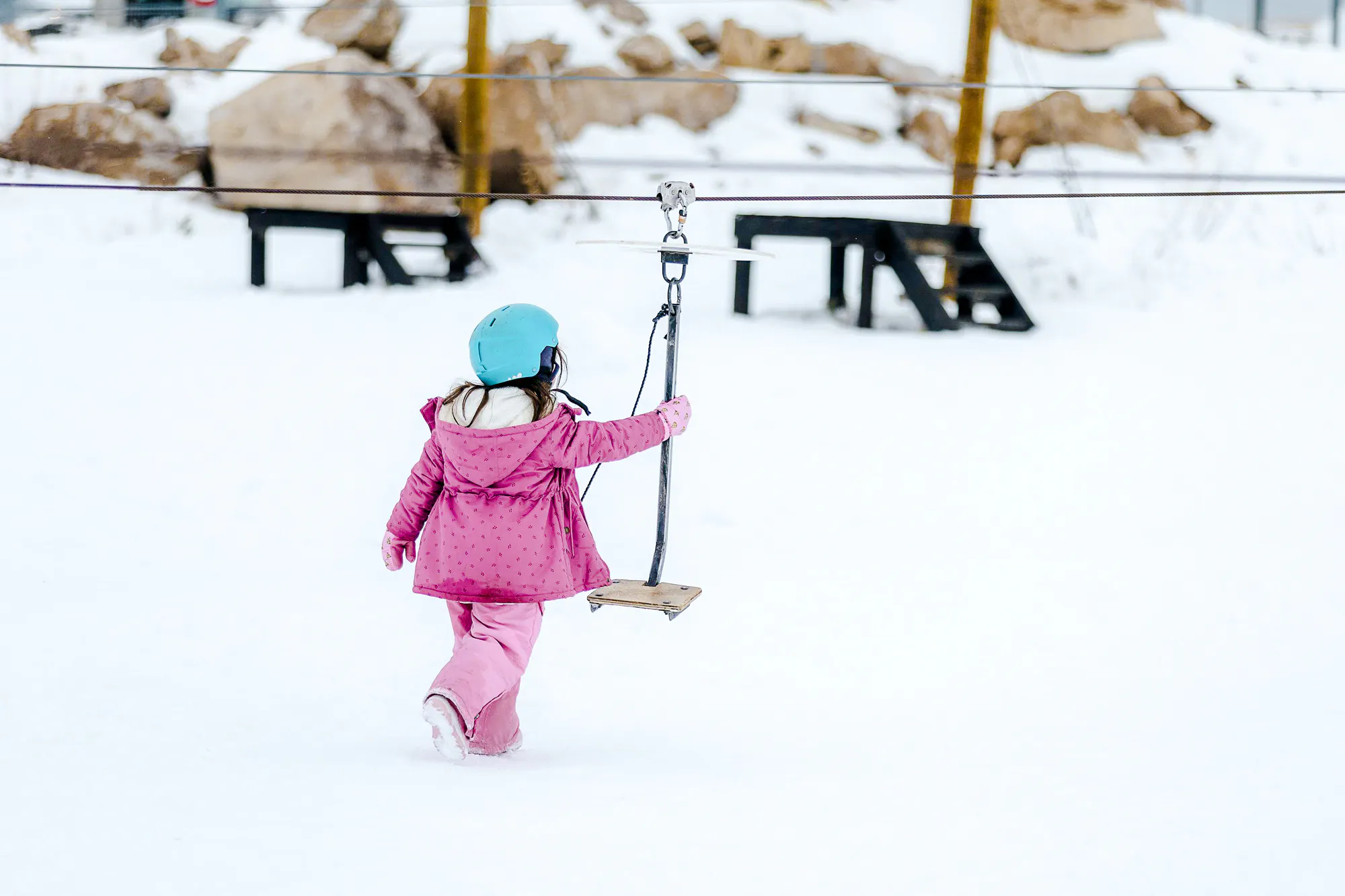Child using ski lift at Farellones Ski, Santiago.