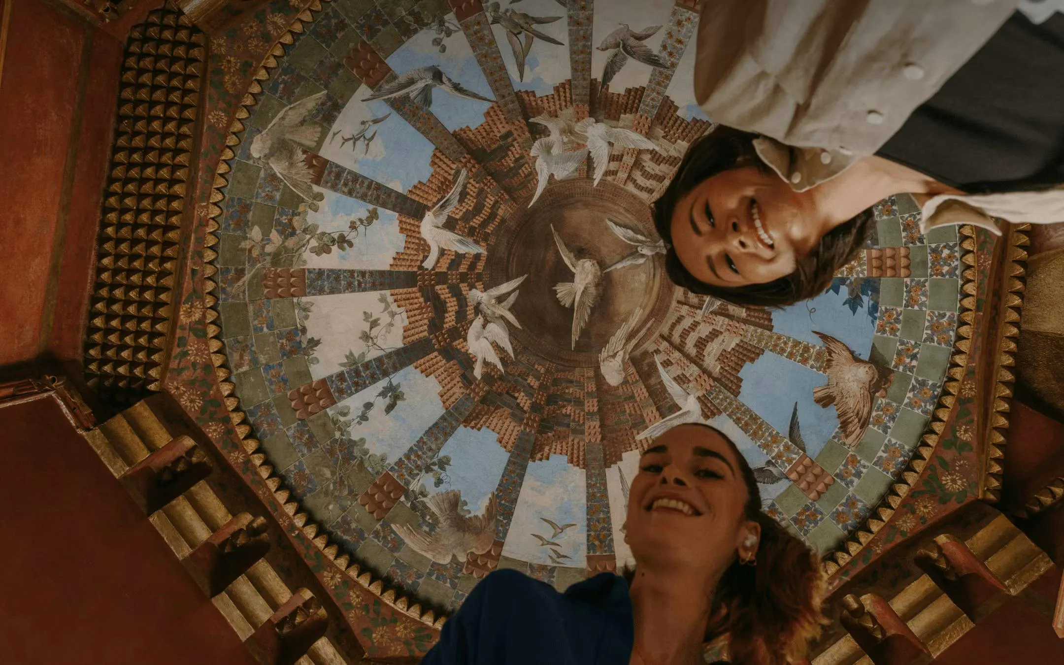 Tourists admire the intricate ceiling design at Casa Vicens in Barcelona.
