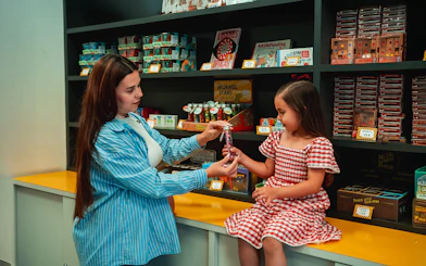 Child receiving a gift at the Museum of Illusions gift shop in Madrid.