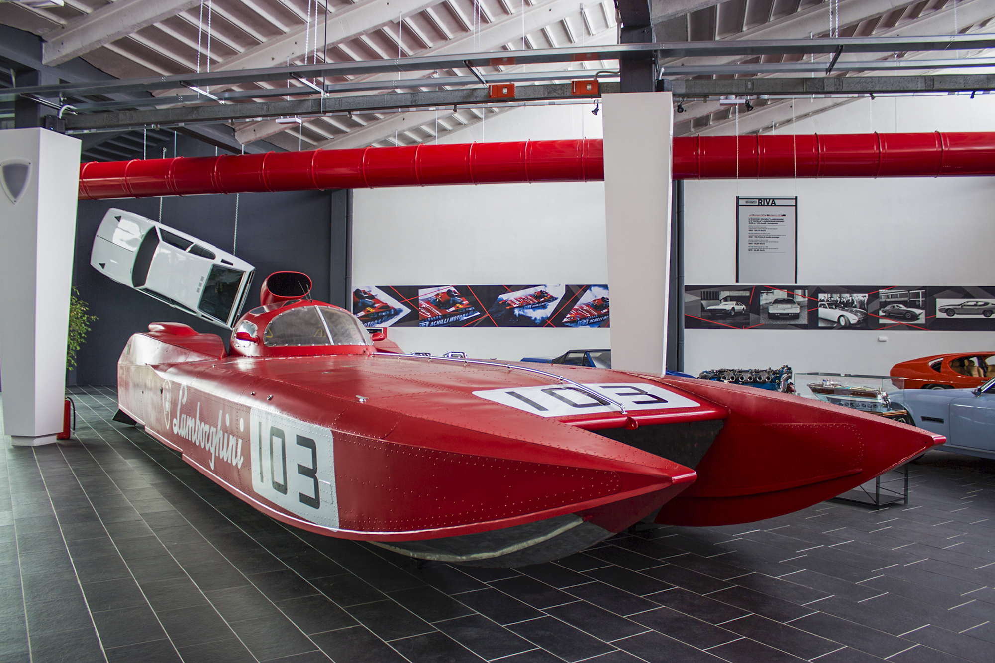 Red Lamborghini speedboat exhibit at Ferruccio Lamborghini Museum, Bologna, Italy.