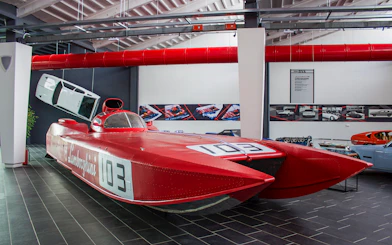Red Lamborghini speedboat exhibit at Ferruccio Lamborghini Museum, Bologna, Italy.