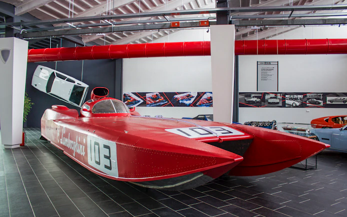 Red Lamborghini speedboat exhibit at Ferruccio Lamborghini Museum, Bologna, Italy.