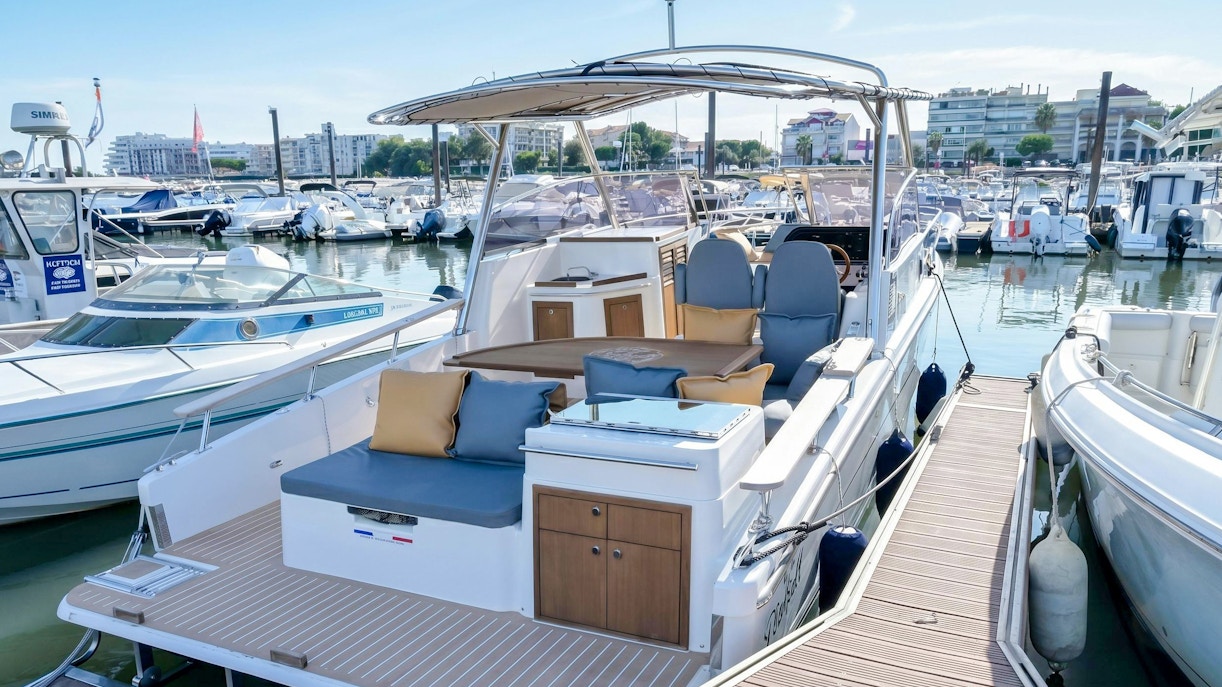 Excursion boats docked in Calanques de Cassis marina, ready for tours.