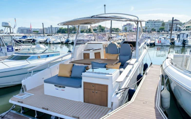 Excursion boats docked in Calanques de Cassis marina, ready for tours.