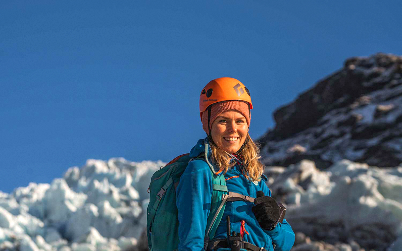 Guest hiking on Vatnajökull glacier in Iceland with safety gear.
