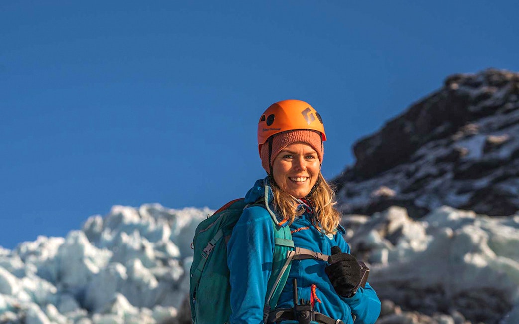 Guest hiking on Vatnajökull glacier in Iceland with safety gear.