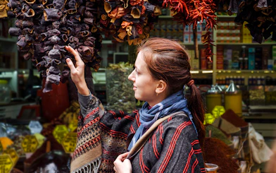 Woman exploring spice market on Istanbul Asian Side Walking Tour.